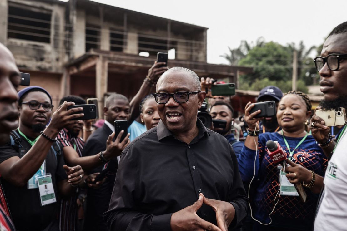 Labour Party presidential candidate Peter Obi (C) talks to the media at outside a polling station in Amatutu in western Anambra State on Saturday. 