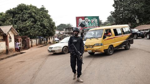 A Department of State Services (DSS) official stands guard at a polling station in Amatutu in western Anambra State on Saturday. 