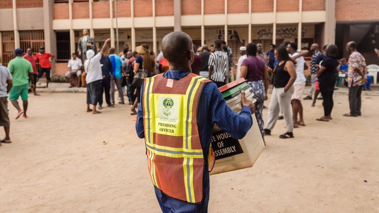 Independent National Electoral Commission (INEC) officials set up voting materials at a polling station in Ojuelegba, Lagos, on February 25, 2023, before polls opened.