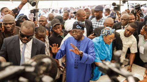 All Progressives Congress (APC) presidential candidate Bola Tinubu and his wife Oluremi Tinubu arrive to vote at a polling station in Lagos on Saturday during Nigeria's presidential and general election.