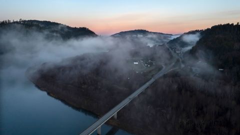 In this aerial image taken from a drone, the city of Klamath, Calif., home of the tribal headquarters for the Yurok Tribe, dots the side of U.S. Highway 101 at sunrise on Jan. 21, 2022. 