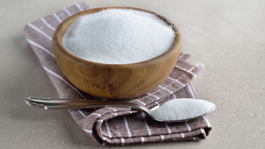 Healthy sugar substitute erythritol on gray background