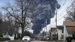 FILE - A black plume rises over East Palestine, Ohio, as a result of a controlled detonation of a portion of the derailed Norfolk Southern trains, on Feb. 6, 2023. Transportation Secretary Pete Buttigieg announced a package of reforms to improve safety Tuesday, Feb. 21 — two days after he warned the railroad responsible for the derailment, Norfolk Southern, to fulfill its promises to clean up the mess just outside East Palestine, and help the town recover. (AP Photo/Gene J. Puskar, File)