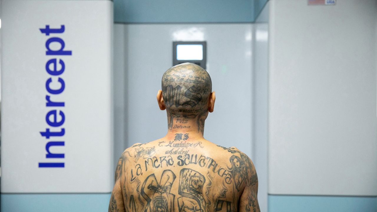 Prisoners were stripped down to white shorts, with their heads shaved. Many had gang tattoos.