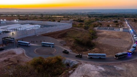 A fleet of buses takes the 2,000 suspected gang members to the new prison.