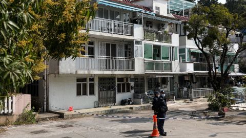 Police stand guard outside the house Choi's remains are believed to have been found, in Tai Po, Hong Kong on February 26.