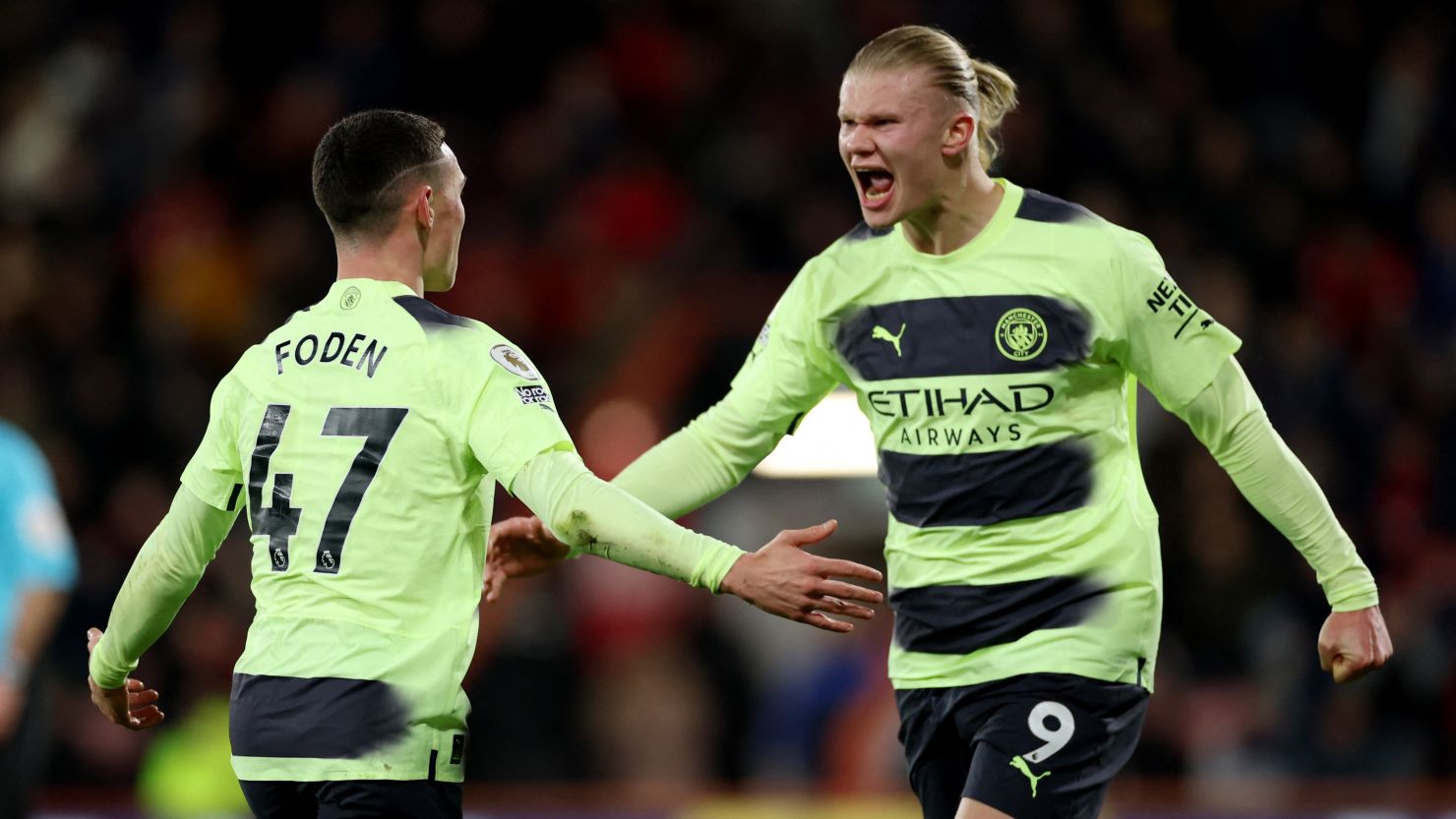 Erling Haaland celebrates with Phil Foden on Saturday.