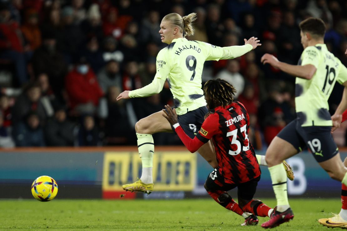 Haaland, left, duels for the ball with Bournemouth's Jordan Zemura on Saturday.