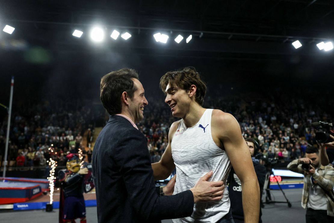 Duplantis (right) celebrates after setting a new pole vault world record with Lavillenie (left). 