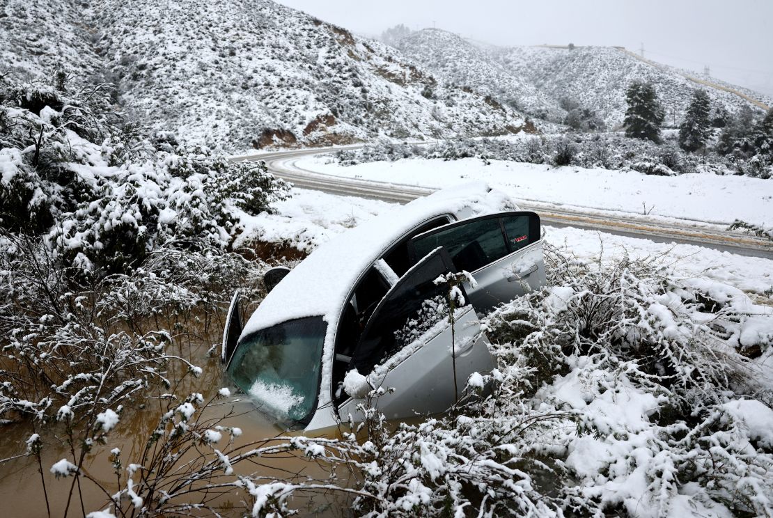 A vehicle skidded off the snowy roadway into a small pond in the Sierra Pelona Mountains near Green Valley, California.