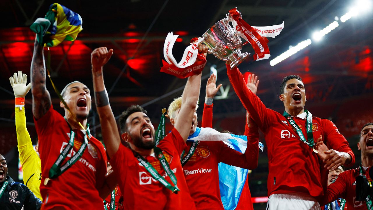 Manchester United's Raphaël Varane, Bruno Fernandes and Antony celebrating after winning the Carabao Cup final.