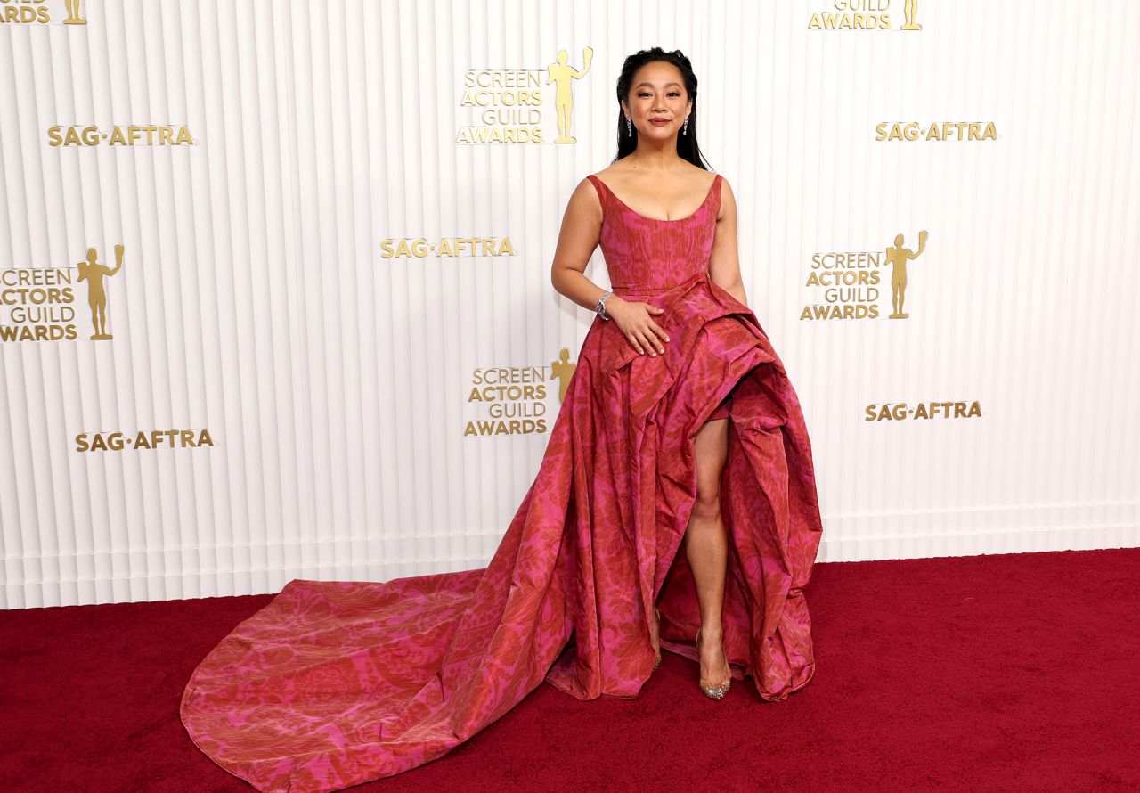 "Everything Everywhere All at Once" star Stephanie Hsu wore a floral Carolina Herrera dress with an extravagant train. 