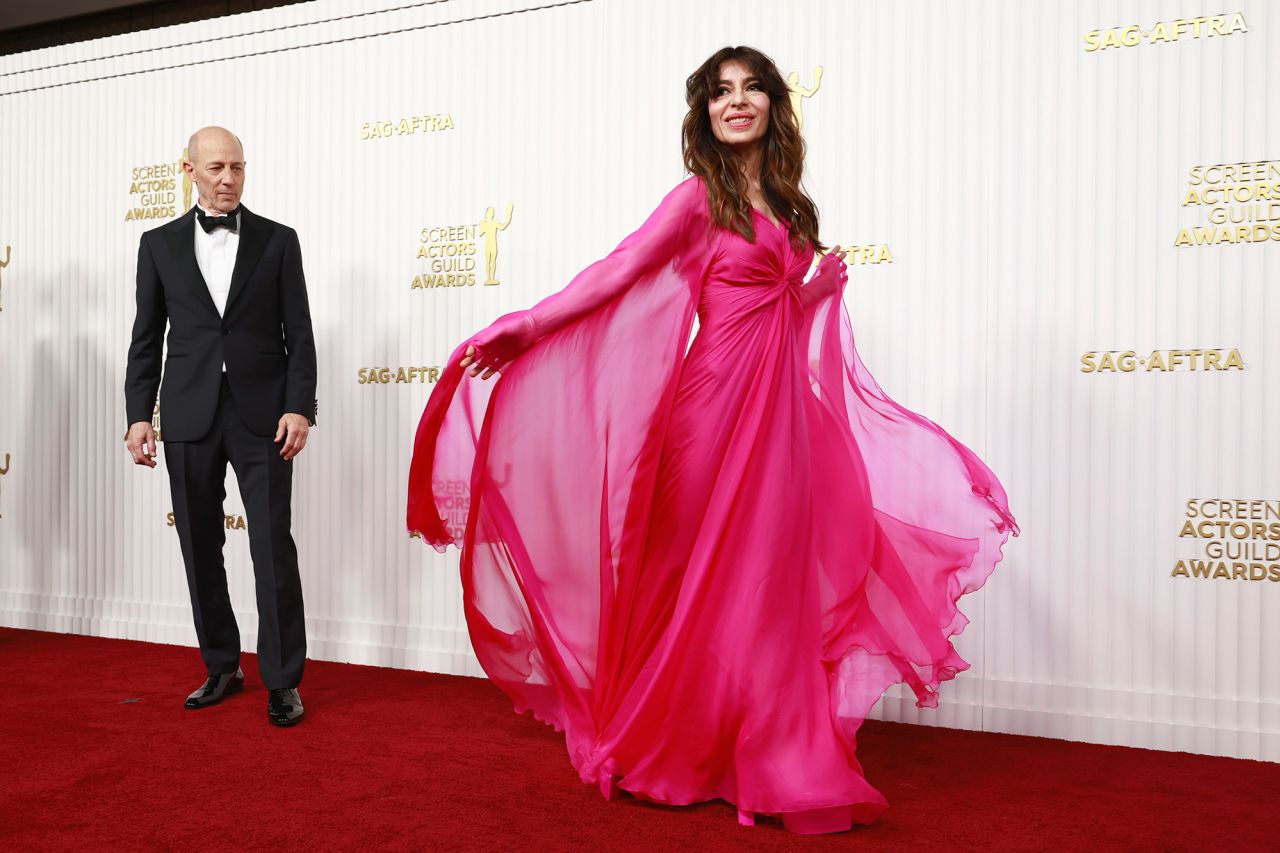 Jon Gries, in a Canali tuxedo, poses alongside "The White Lotus" co-star Sabrina Impacciatore, who wore a flowy pink Valentino gown and Pomellato jewelry.