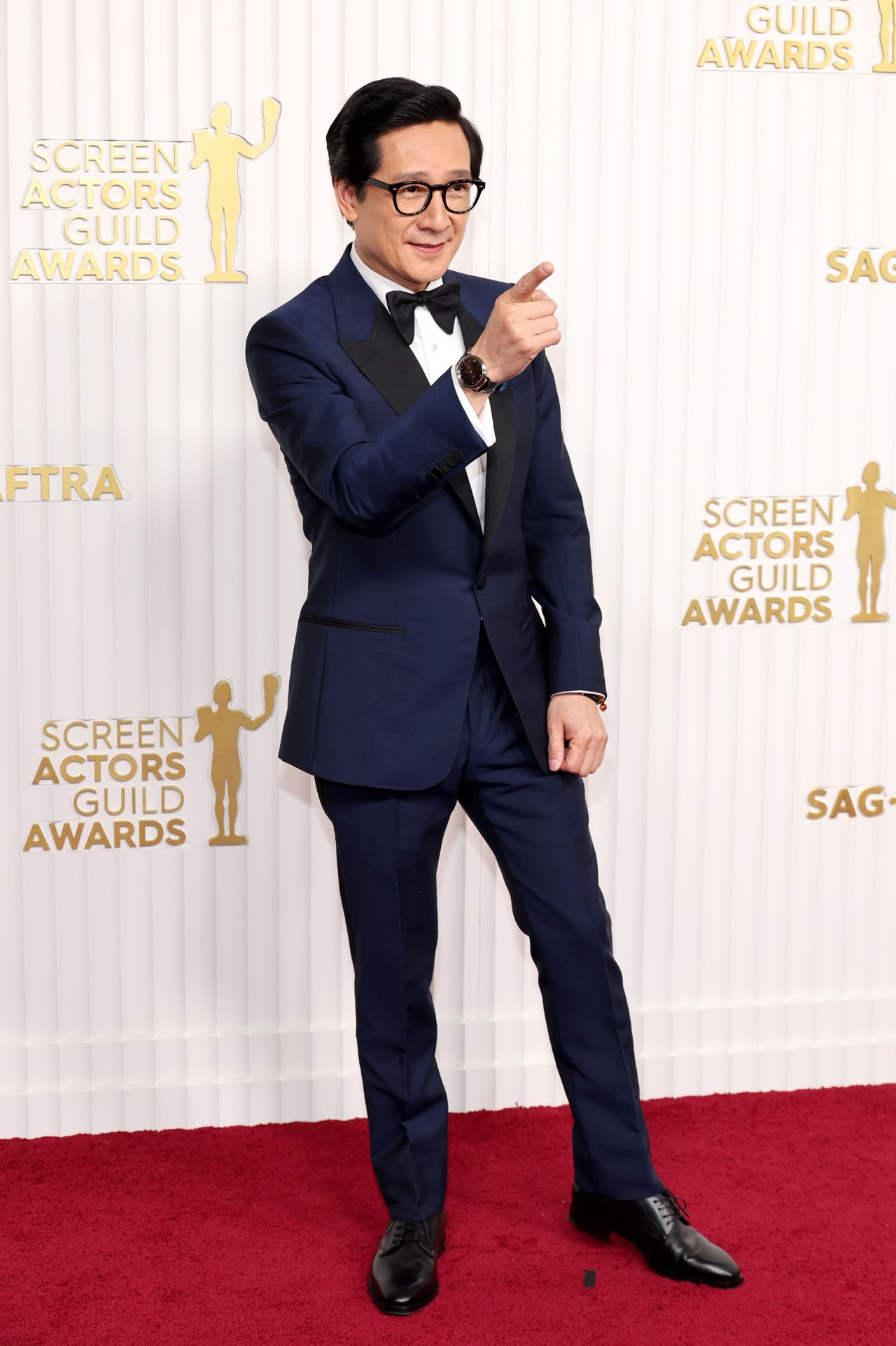 Ke Huy Quan, nominated for his turn in "Everything Everywhere All at Once," accessorized his navy tuxedo with a statement De Beers broach and an Omega watch.