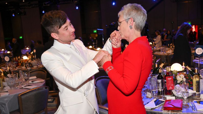 Jamie Lee Curtis kisses Barry Keoghan's hand before the start of the show. 
