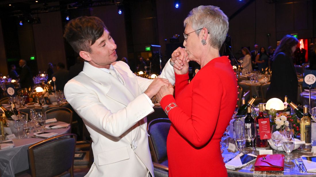 Jamie Lee Curtis kisses Barry Keoghan's hand before the start of the show. 