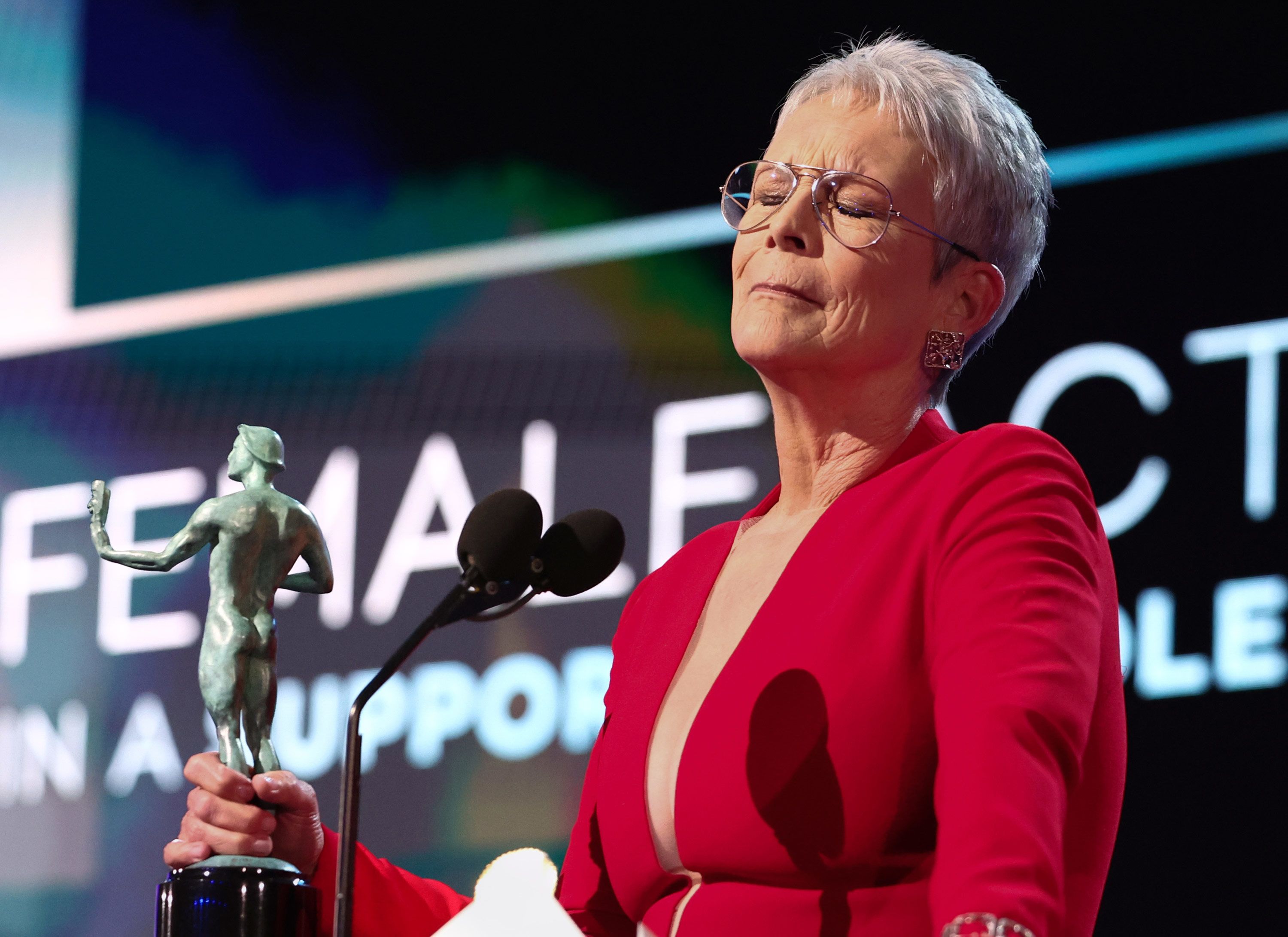 Jamie Lee Curtis reacts to winning the female actor in a supporting role in a film award for "Everything Everywhere All at Once."