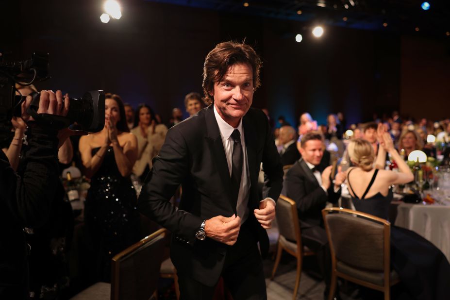 Jason Bateman walks to the stage to accept the male actor in a drama series award for "Ozark."