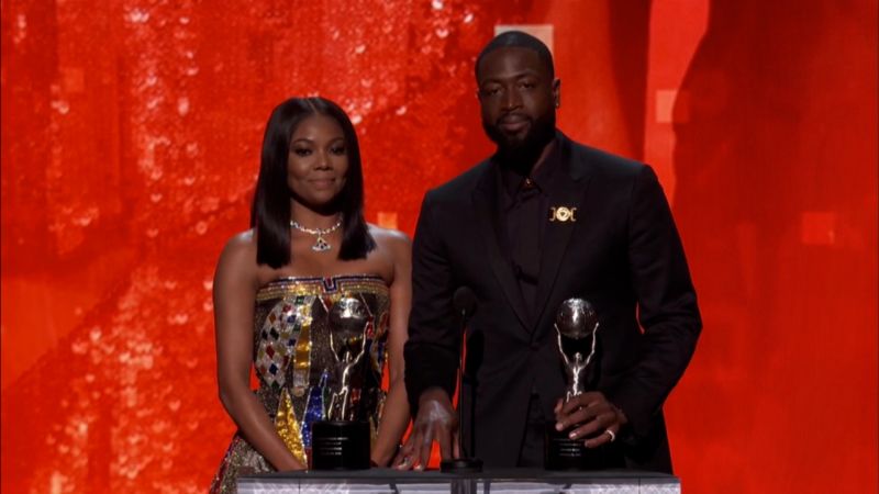 NextImg:Dwyane Wade and Gabrielle Union honor trans daughter Zaya during LGBTQ speech at NAACP Image Awards | CNN Business