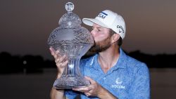 Chris Kirk kisses the trophy after winning the Honda Classic golf tournament in a playoff against Eric Cole, Sunday, Feb. 26, 2023, in Palm Beach Gardens, Fla. (AP Photo/Lynne Sladky)