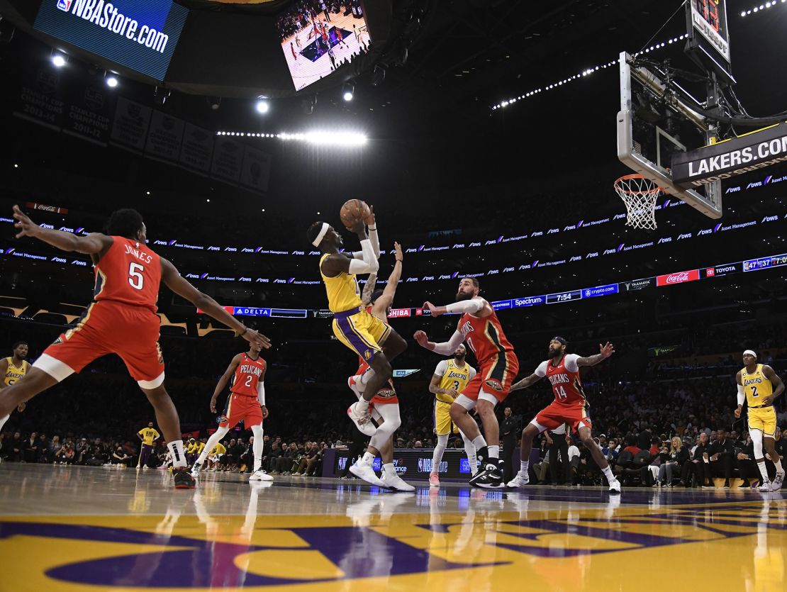 Dennis Schröder of the Los Angeles Lakers shoots over Jonas Valančiūnas of the New Orleans Pelicans.