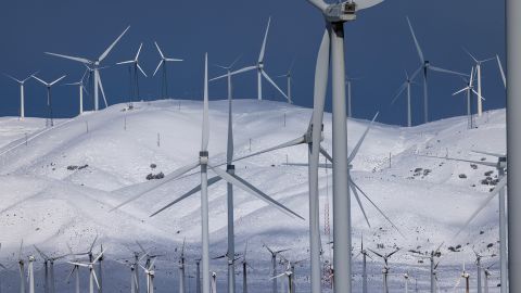 Wind turbines near Mohave, California, are surrounded by fresh snow on February 26, 2023.
