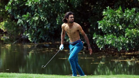 Akshay Bhatia: Golfer takes off shirt to play muddy shot — twice.