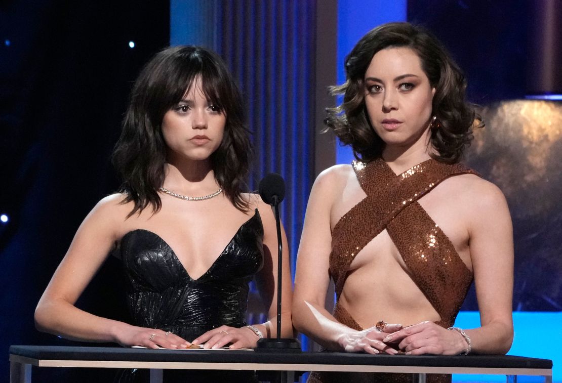 Jenna Ortega, left, and Aubrey Plaza present the award for outstanding performance by a male actor in a television movie or limited series.
