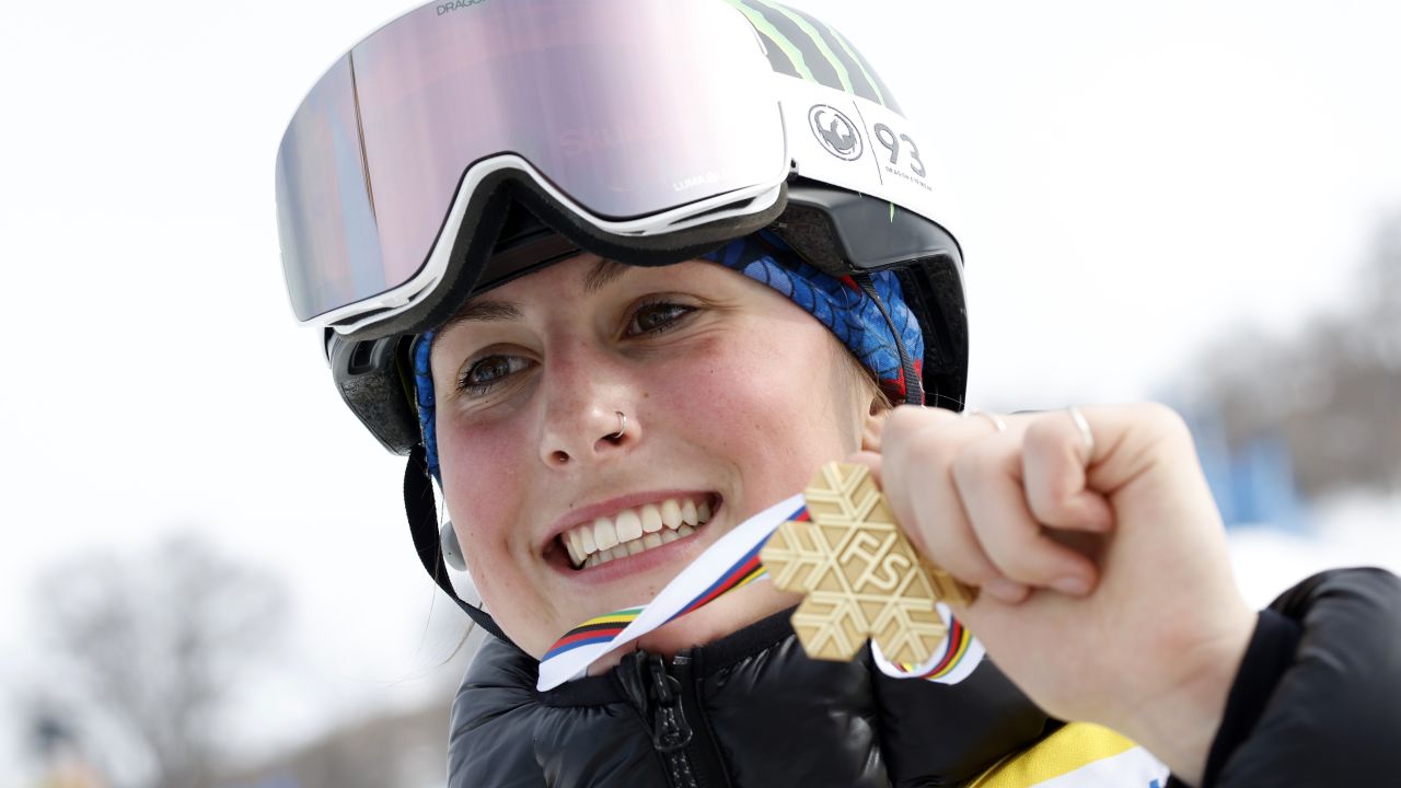 Mia Brookes poses with her gold medal at the FIS Snowboard World Championships. 