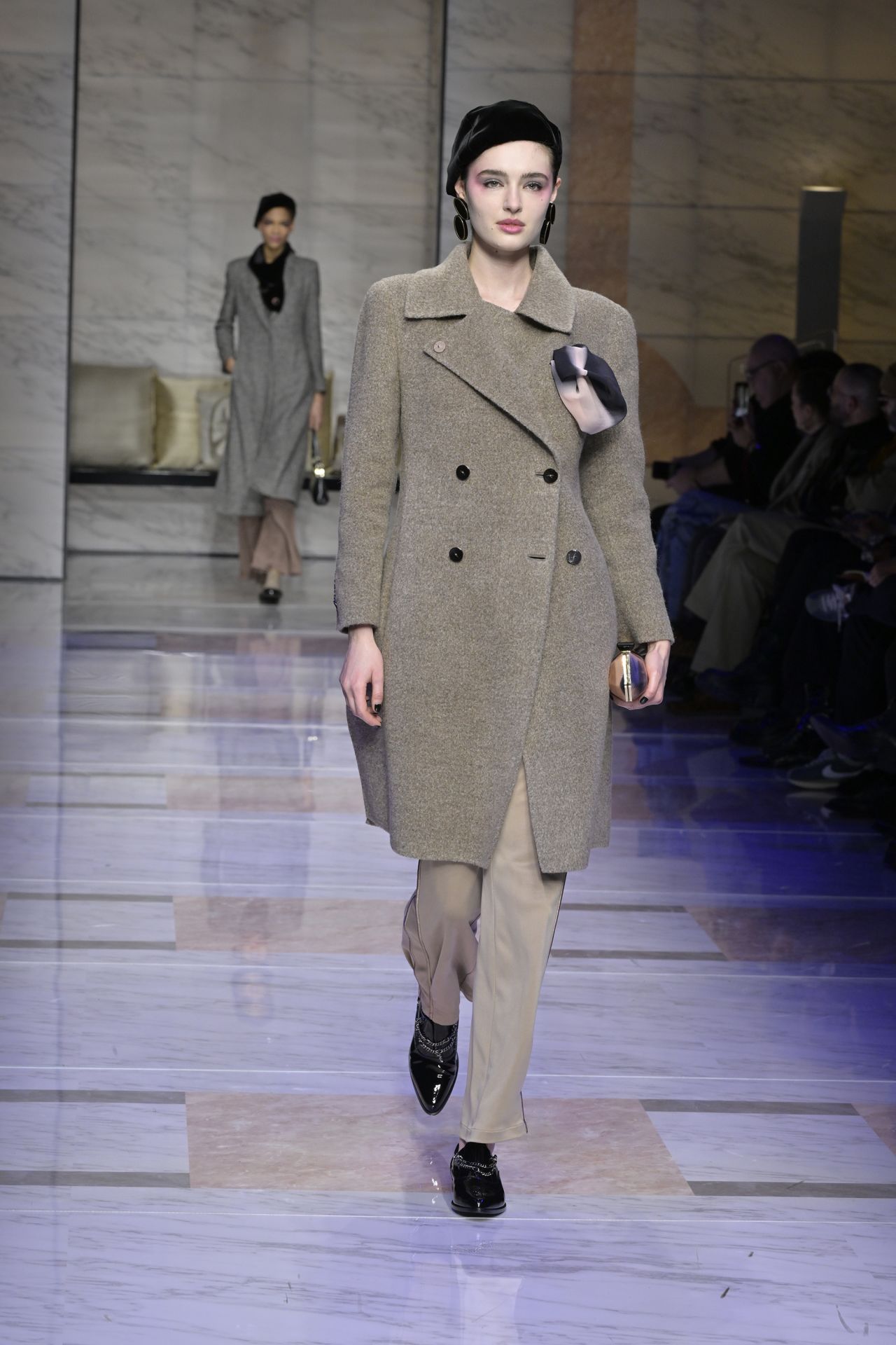 And again gray coasts appeared at Giorgio Armani, who was one of the designers adopting a more a wearable approach to Fall-Winter 2023.