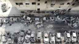 An aerial view shows a building and cars burnt in an attack by Israeli settlers, following an incident where a Palestinian gunman killed two Israeli settlers, near Hawara in the occupied West Bank on Monday.