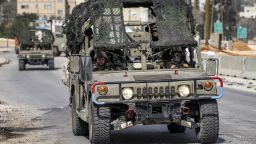 Israeli soldiers ride in a military vehicle in the town of Huwara, near Nablus in the West Bank, on February 27, 2023.