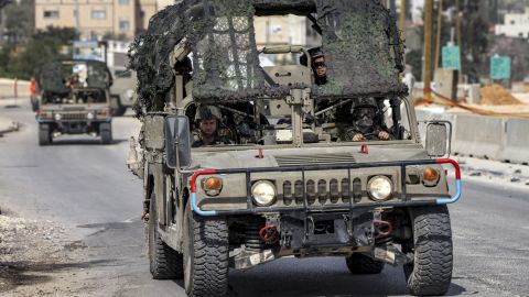 Israeli soldiers ride in a military vehicle in Huwara, near Nablus in the West Bank, on Monday.