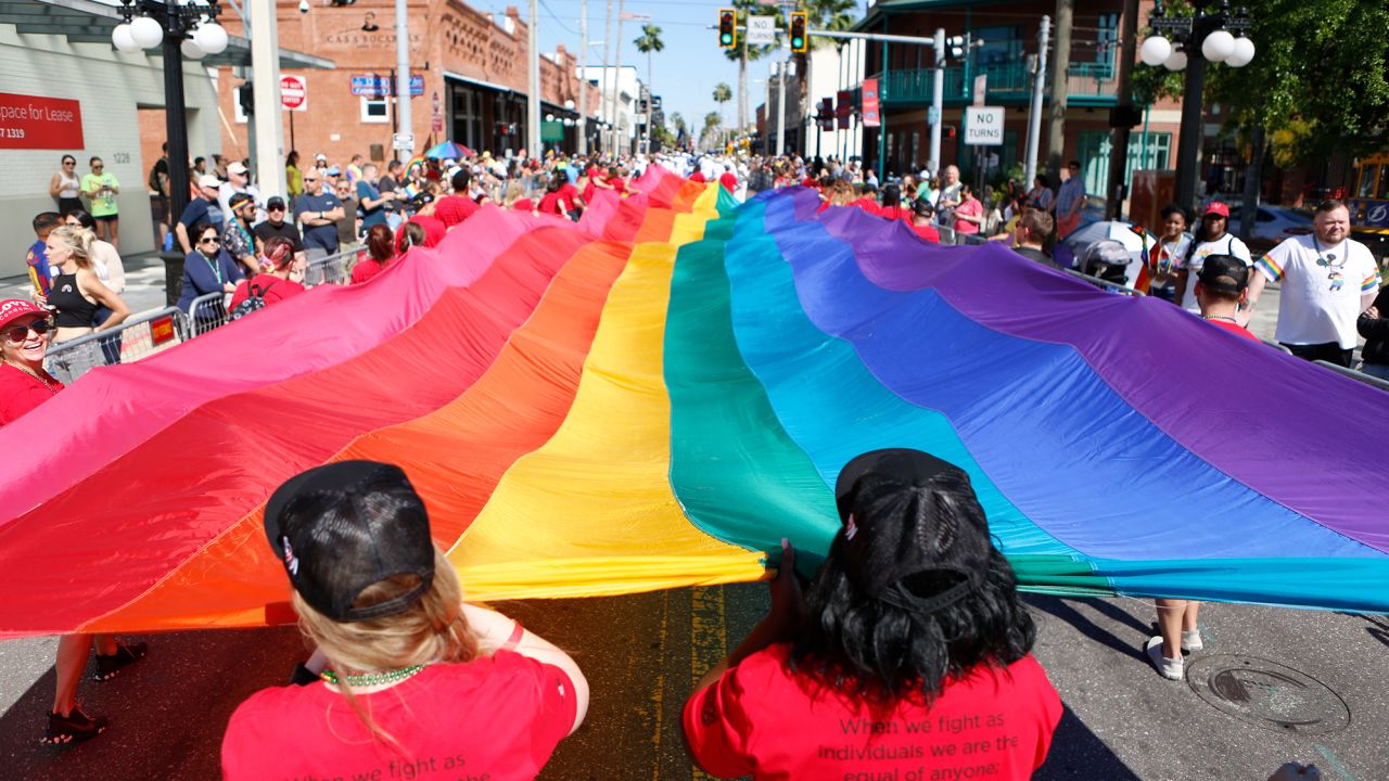 Revelers celebrate during the Tampa Pride Parade on March 26, 2022 in Tampa, Florida.