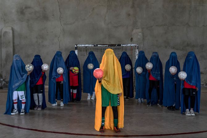 A girls soccer team poses for photographer Ebrahim Noroozi, in Kabul, Afghanistan.