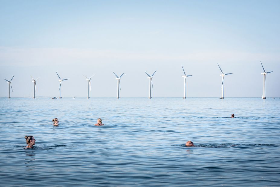 A view of the Middelgrunden offshore wind farm, taken from a beach in Copenhagen, Denmark, by photographer Simone Tramonte. 