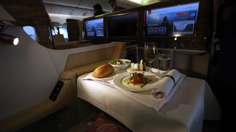 It might be tempting to make the most of business class culinary offerings, but flight attendant Kris Major says you should prioritize sleep.