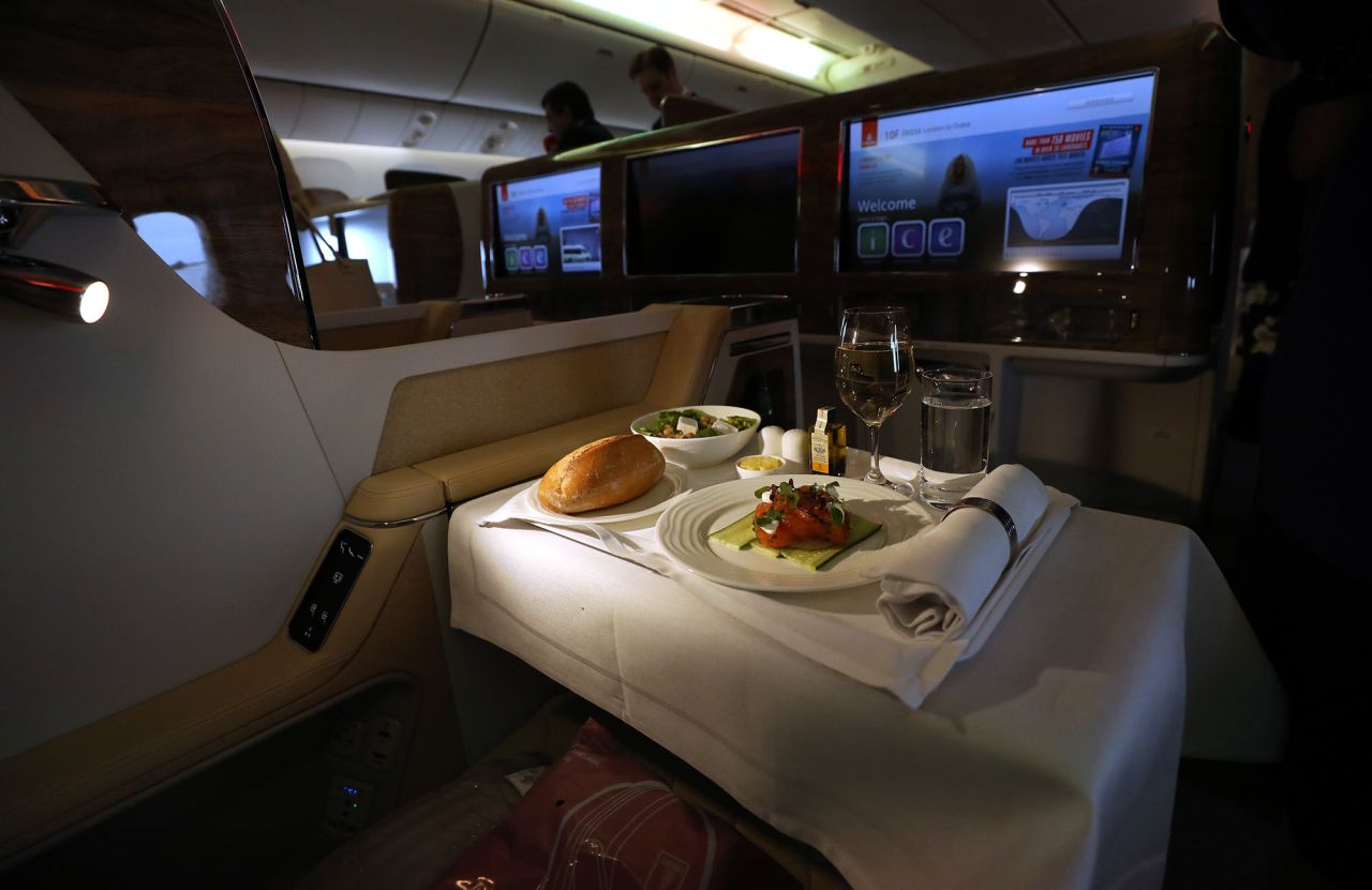 It might be tempting to make the most of business class culinary offerings, but flight attendant Kris Major says you should prioritize sleep.