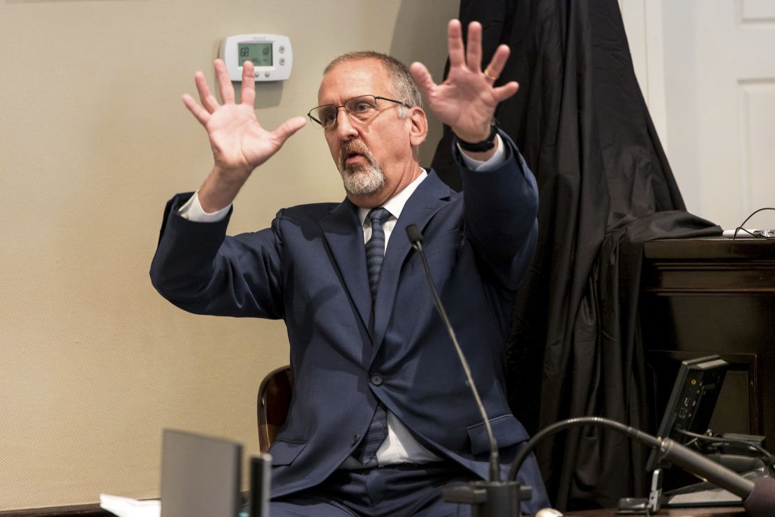 Timothy Palmbach, a forensic scientist, demonstrates the effect of a shotgun blast as he testifies during Alex Murdaugh's double murder trial at the Colleton County Courthouse on Monday, February 27, 2023.