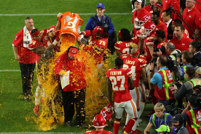 How can a head coach look on edge after winning the Super Bowl? It might be because he knows a cooler of energy drink is about to come splashing over his head. The "Gatorade shower" has become a tradition for marking big wins across various US sports, especially in the NFL's biggest game. Pictured, after a<a href="index.php?page=&url=https%3A%2F%2Fwww.cnn.com%2F2020%2F02%2F02%2Fus%2Fchiefs-vs-49ers-super-bowl-liv%2Findex.html" target="_blank"> long-awaited first winner's ring</a>, head coach Andy Reid finally got his first Gatorade bath when his Kansas City Chiefs defeated the San Francisco 49ers in 2020.