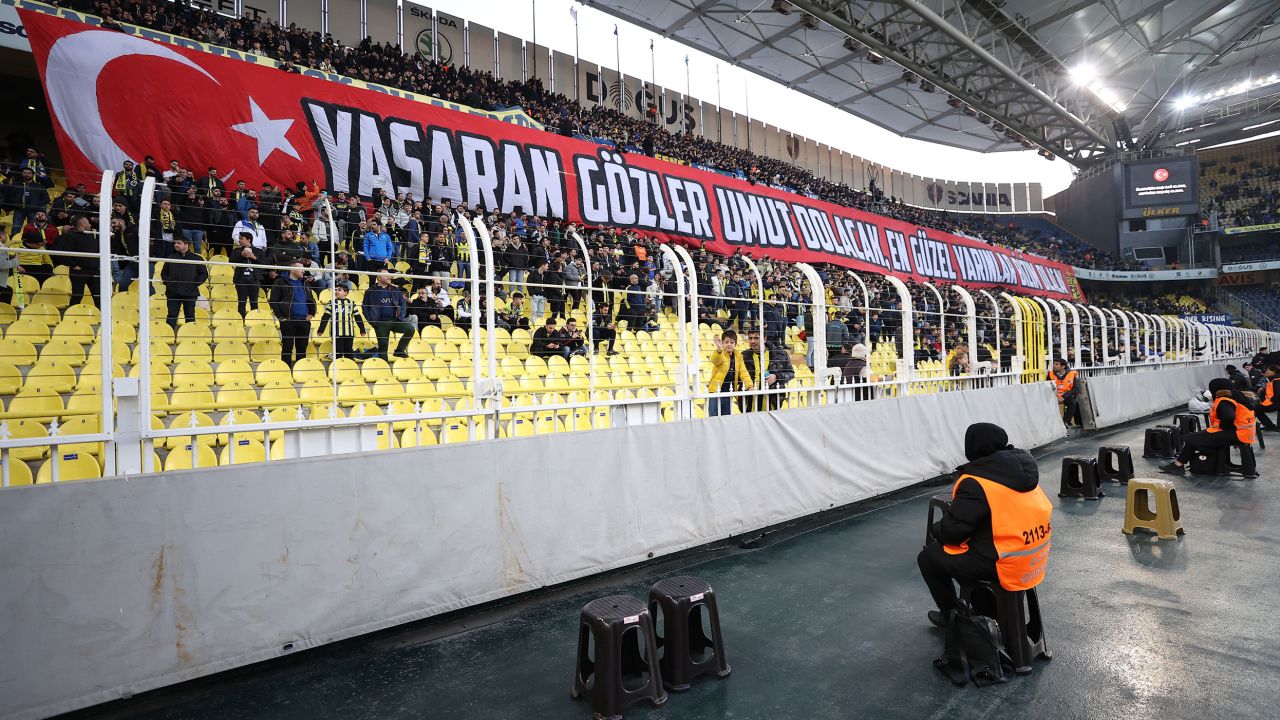 Fans open a banner addressing the devastating earthquakes in Turkey during Saturday's match between Fenerbahçe and Konyaspor.