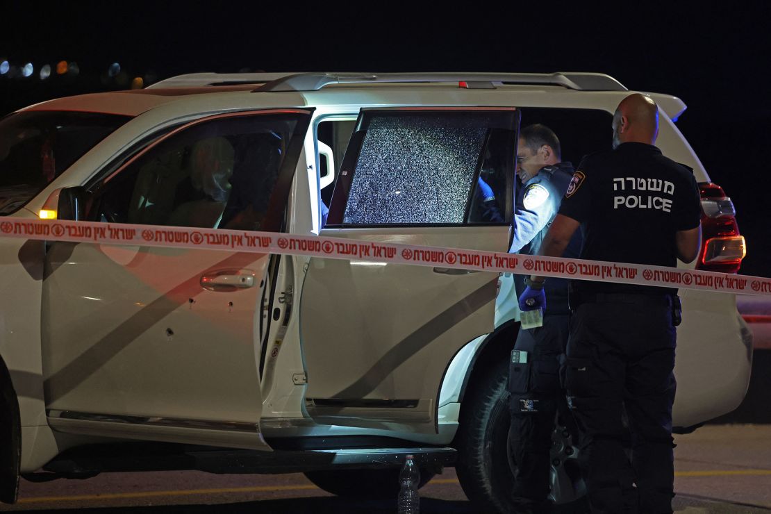 Israeli security forces examine a vehicle riddled with bullet holes, after an Israeli-American citizen was shot near Jericho in the occupied West Bank on February 27.