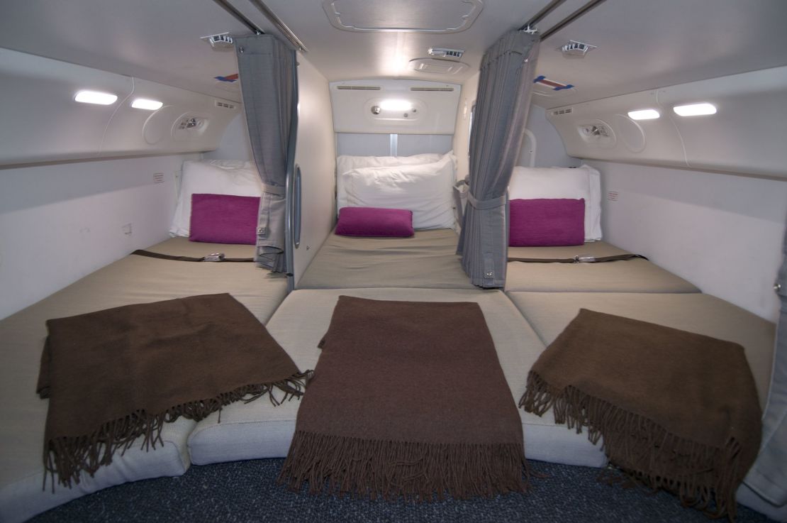 Flight attendants on long-haul flights are provided with spaces to rest. Here's a photo of the crew rest area on a Boeing 787.