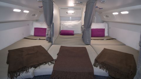 Flight attendants on long haul flights are provided with spaces to rest. Here's a photo of the crew rest area on a Boeing 787.