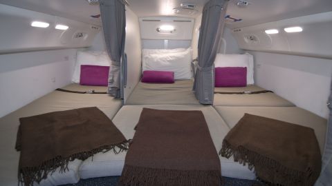 Flight attendants on long-haul flights are provided with spaces to rest. Here's a photo of the crew rest area on a Boeing 787.