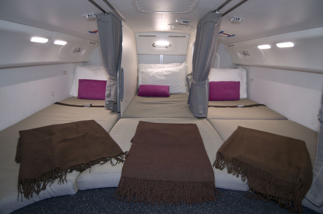 Flight attendants on long-haul flights are provided with spaces to rest. Here's a photo of the crew rest area on a Boeing 787.