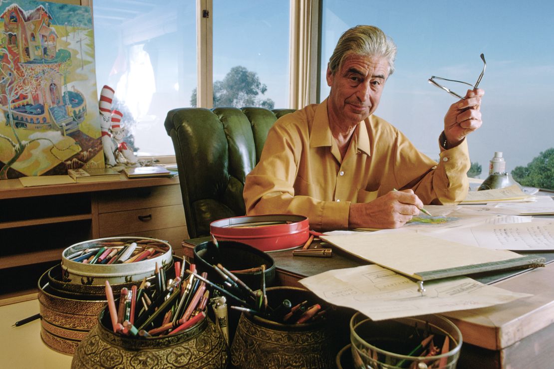 Theodor Seuss Geisel, better known as author Dr. Seuss, drawing at his desk in  1969.