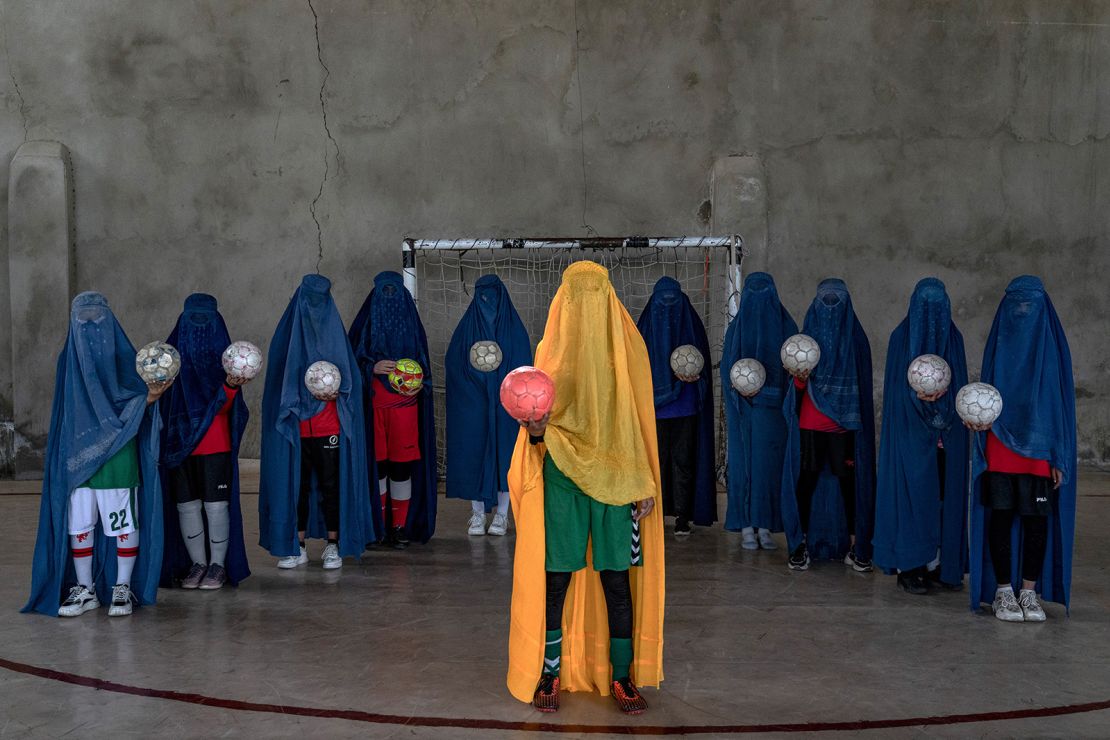 A girls soccer team poses for photographer Ebrahim Noroozi, in Kabul, Afghanistan.