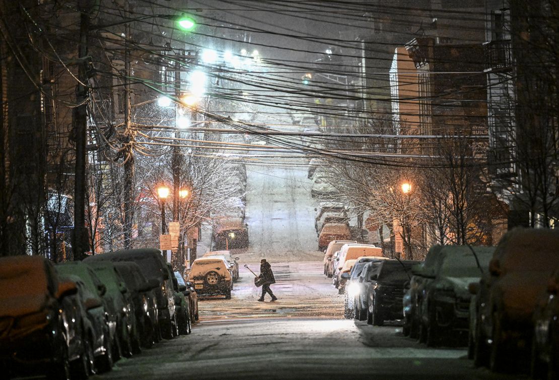 Snow falls on a street in New Jersey on Tuesday, February 28, 2023.