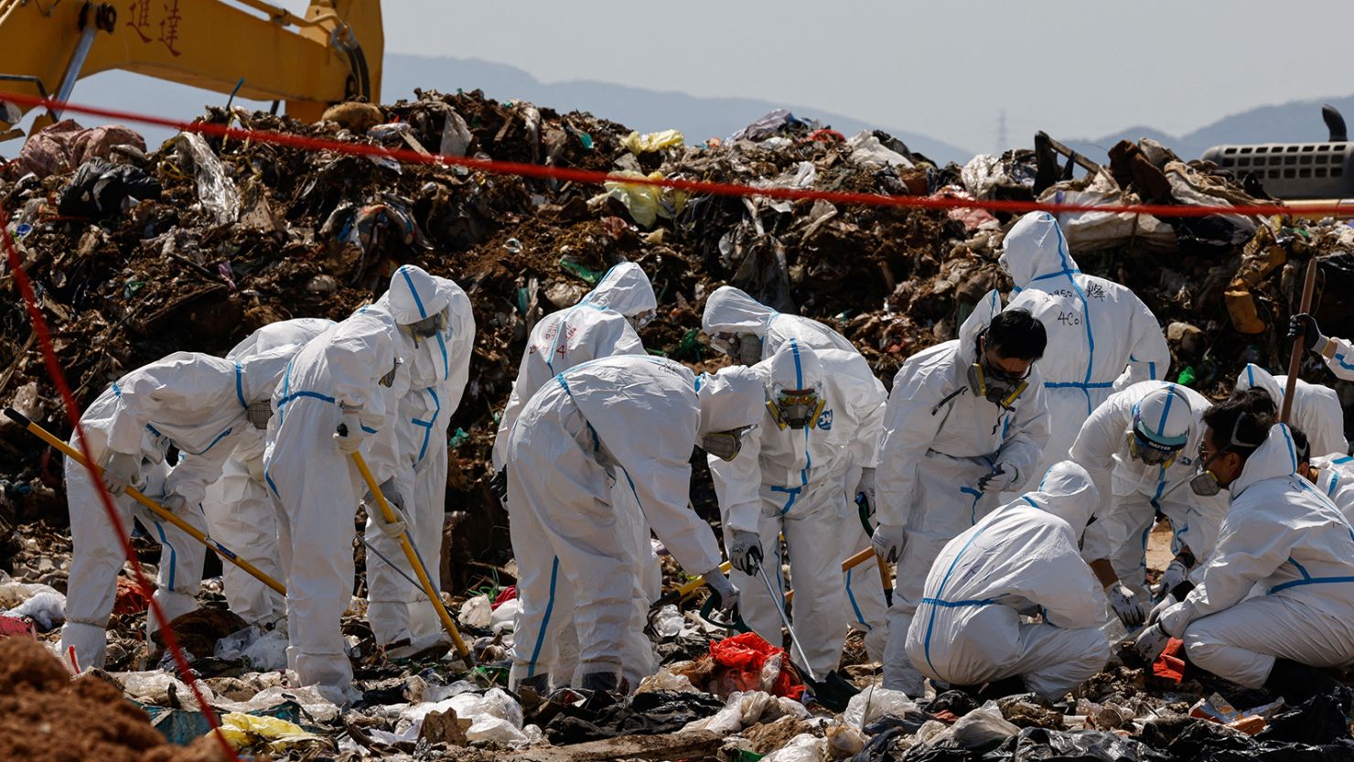 Police excavate a landfill during a search for the body parts of 28-year-old Abby Choi in Hong Kong on February 28.